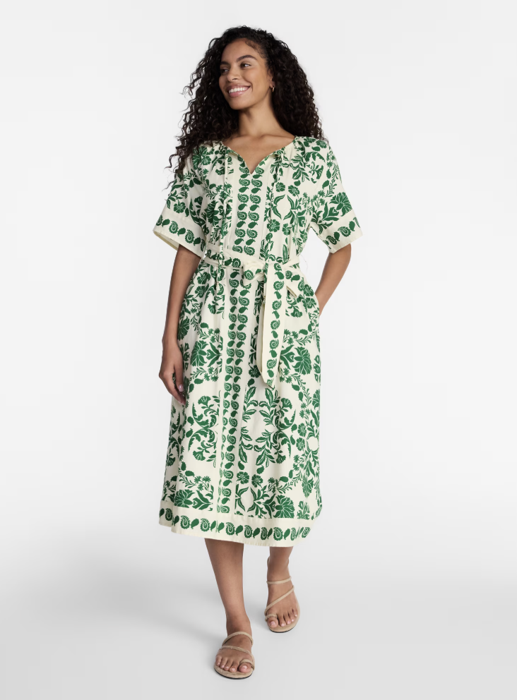 A beautiful linen-blend midi dress featuring an intricate border print design.