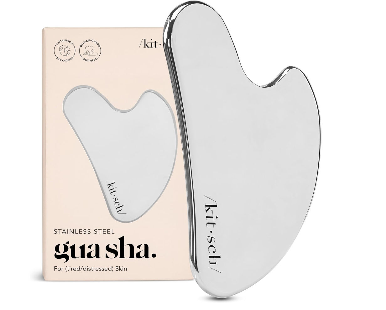 Kitsch Stainless Steel Gua Sha tool and its protective storage pouch for facial massage and lymphatic drainage.