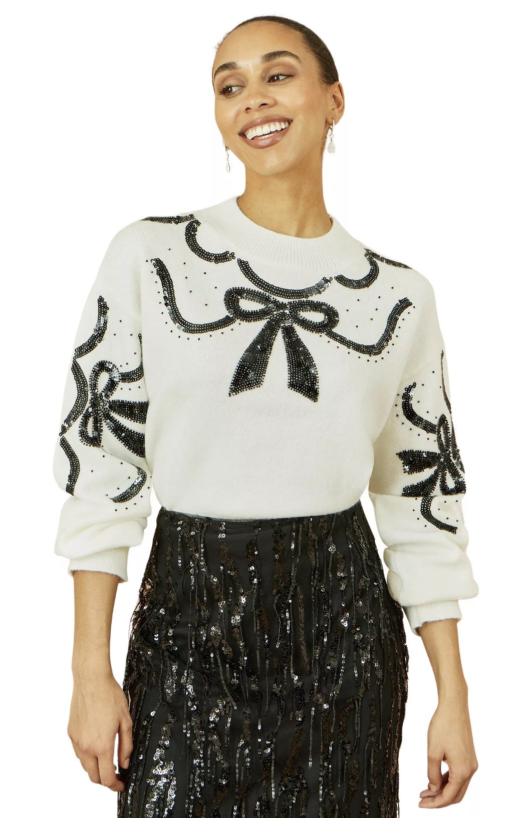 fine-knit sweater, champagne sequin midi skirt, sheer tights and tonal heels.