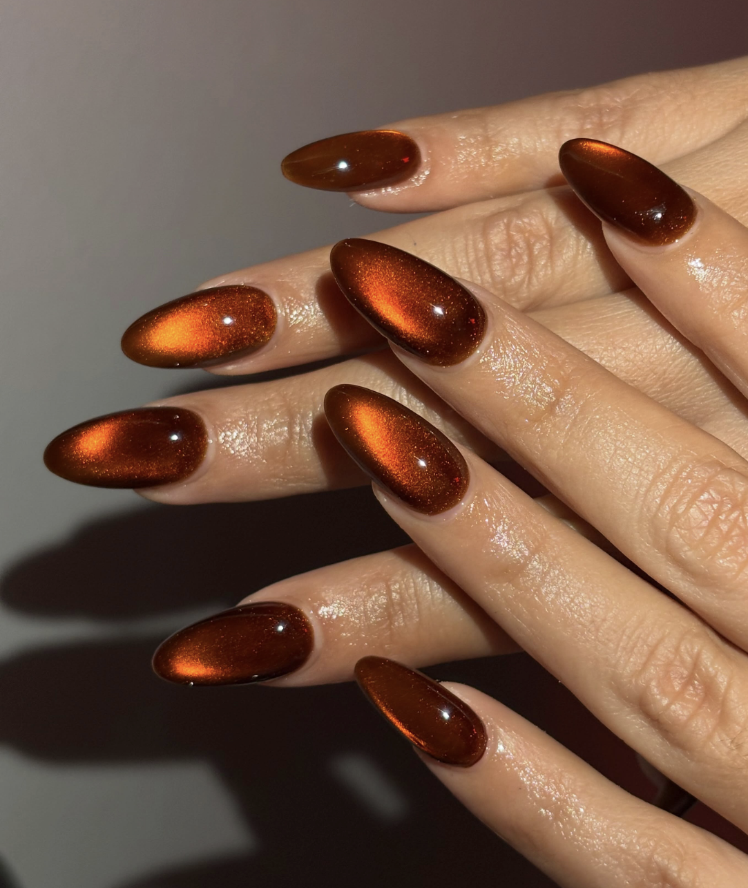 September nail idea featuring amber cat-eye nails