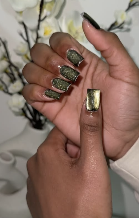 Deep moss green nails with a soft magnetic cat-eye shimmer.