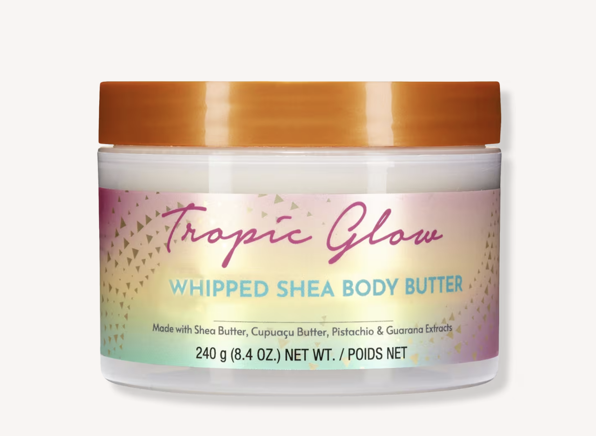 ree Hut Tropic Glow Firming Whipped Body Butter in its gold jar.