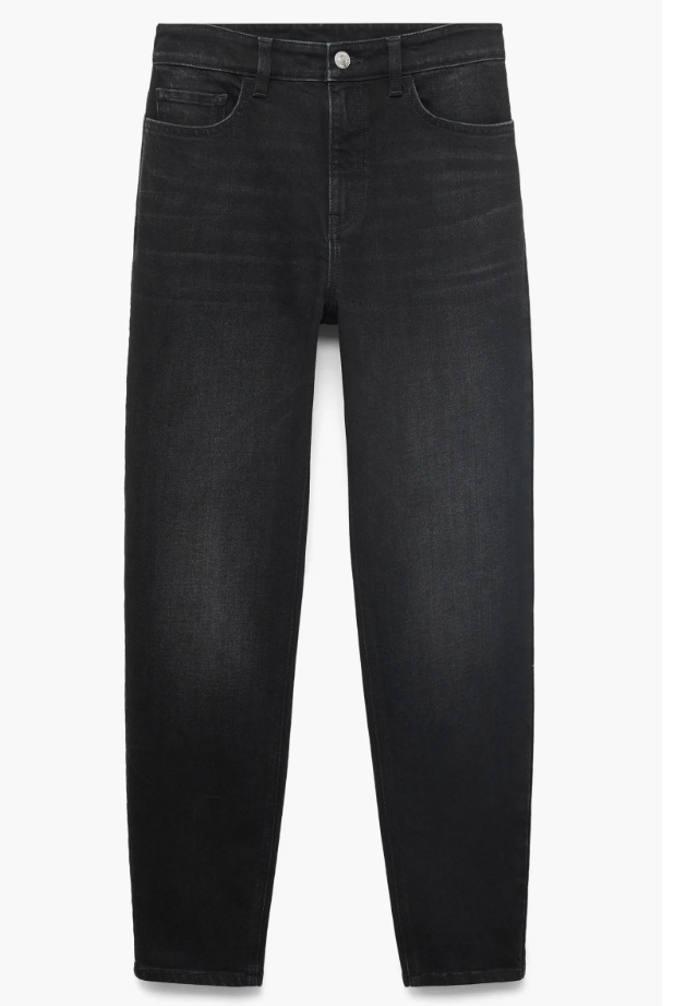 Woman wearing Mango high waist ankle mom jeans in black denim showing the tapered leg and high-rise fit.
