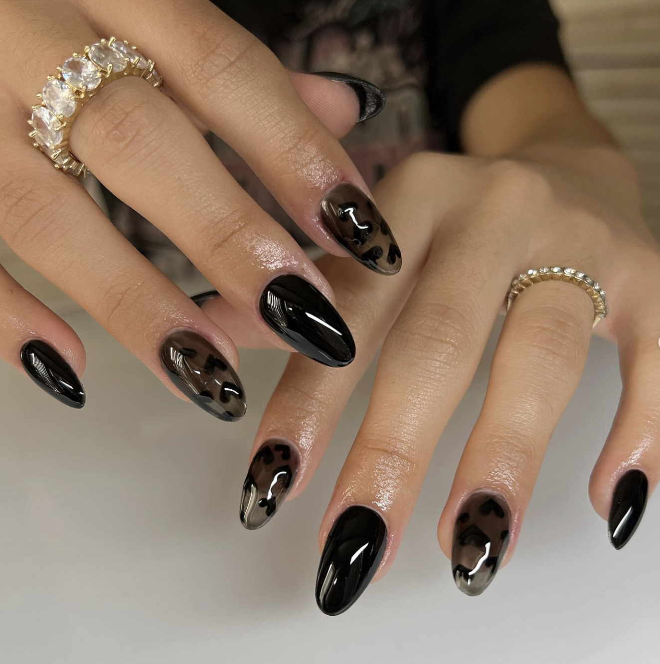 Short natural nails with a translucent smoked-cola jelly manicure.