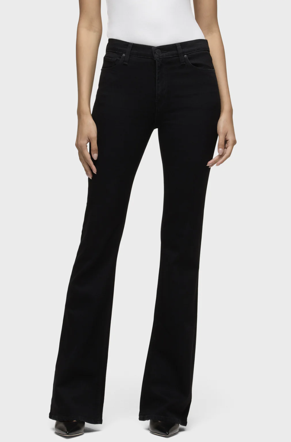 Model wearing Hudson Barbara High-Rise Bootcut Jeans in a dark wash, featuring a high-rise waist and a classic bootcut flare that provides visual balance for an athletic or rectangle figure.