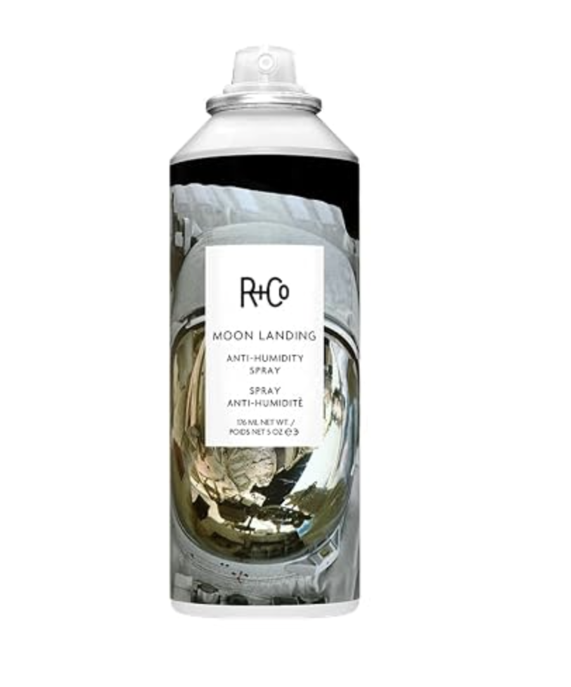 Can of R+Co Moon Landing Anti-Humidity Spray with space-themed packaging.