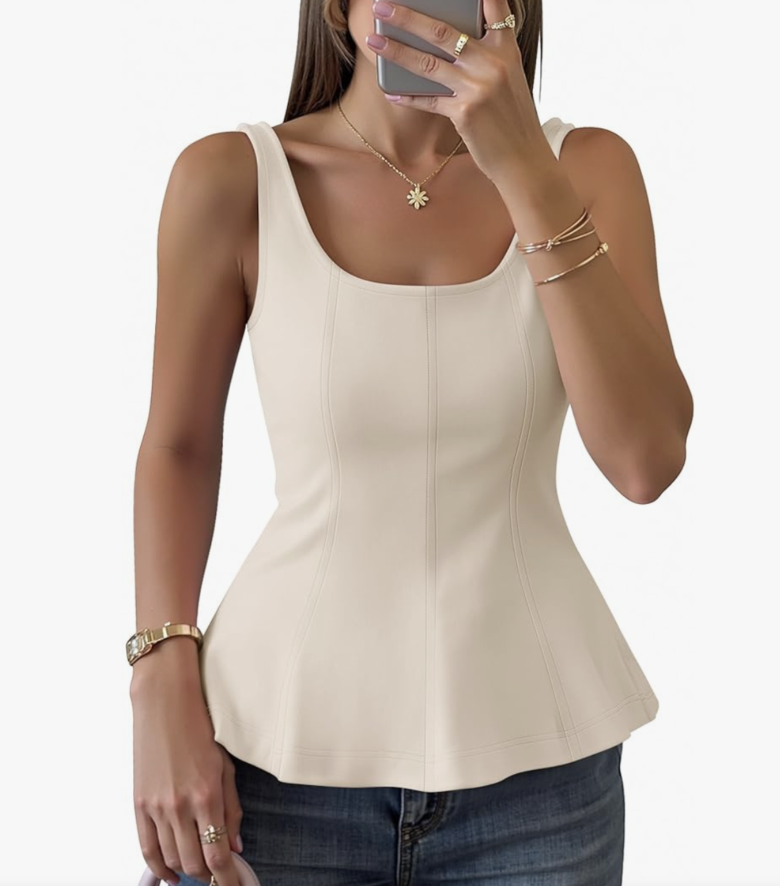 A woman wearing a cream-colored square-neck peplum blouse from Amazon, paired with gold jewelry, styled as part of a Spring capsule wardrobe for women in their 50s.
