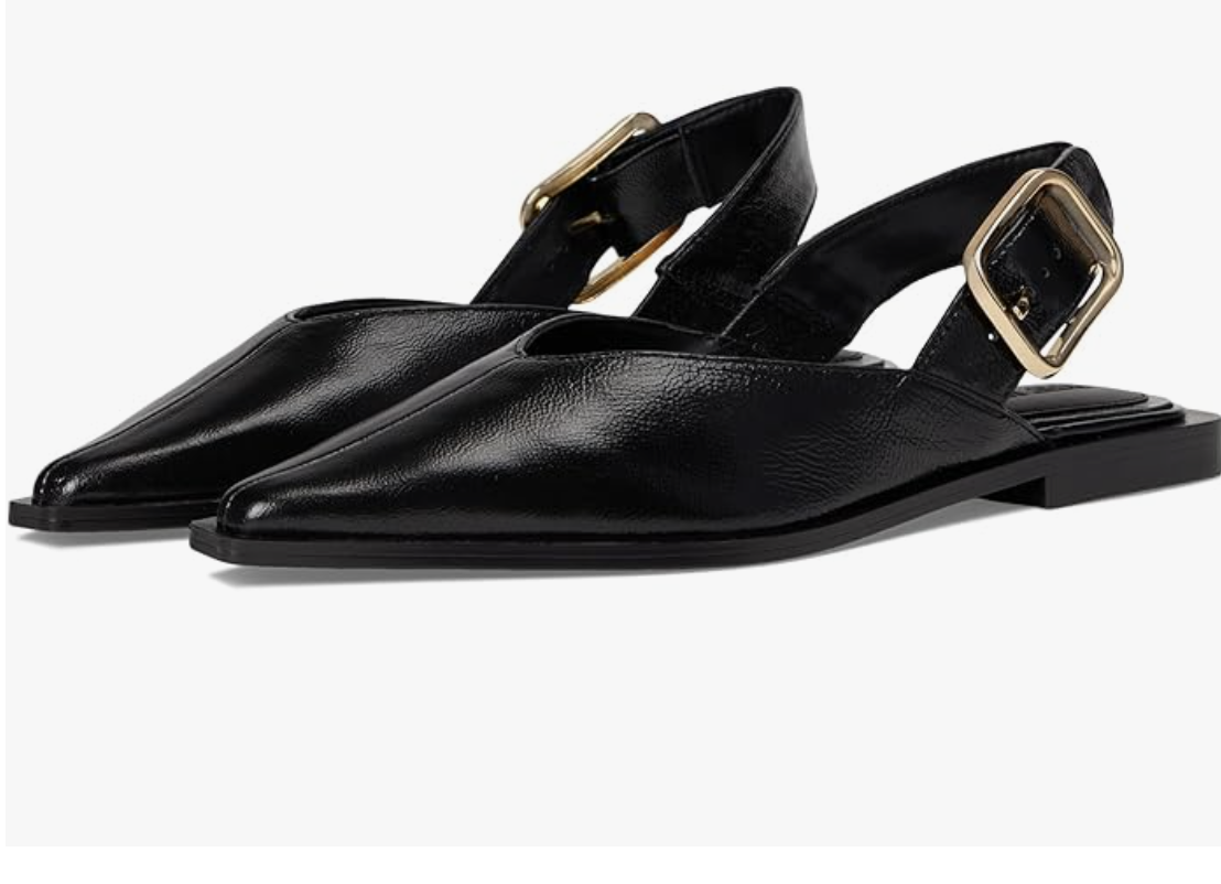 A pair of Steve Madden Shay black leather pointed-toe slingback flats with a gold buckle strap on a white background.