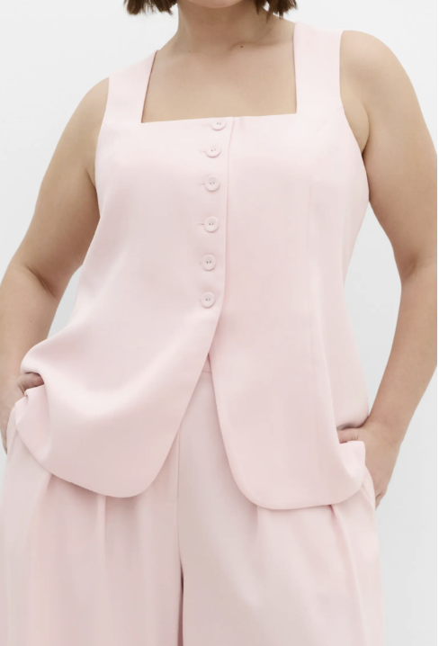 "City Chic Abbie Vest in a pale blush pink, featuring a tailored sleeveless design and open front."