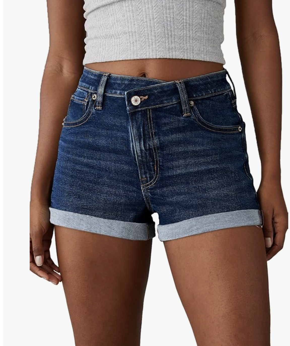 : A close-up of a person wearing comfortable, stretchy-waistband casual shorts in a neutral color.