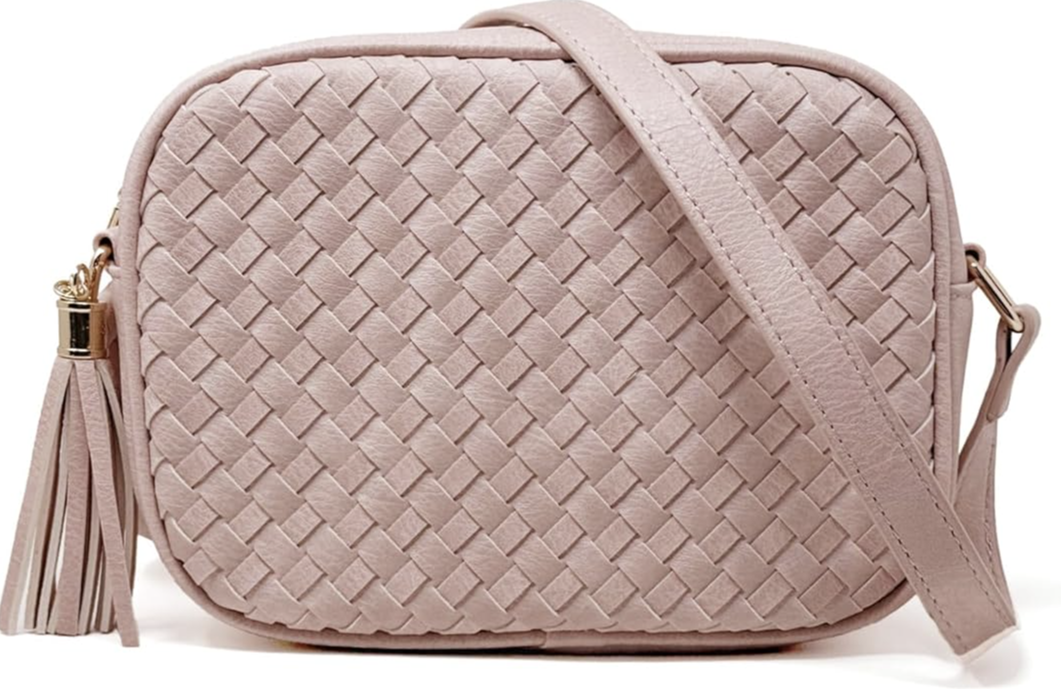 A mauve pink handwoven vegan leather camera-style bag with a long decorative tassel and a matching adjustable crossbody strap.