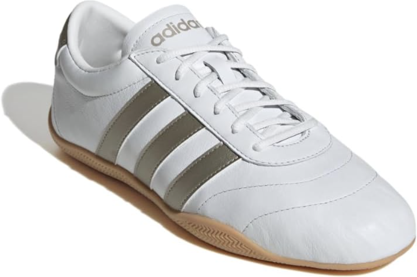 A side profile of a white leather adidas Grand Court Lo sneaker with three khaki green stripes and a gum-colored rubber sole on a transparent background.