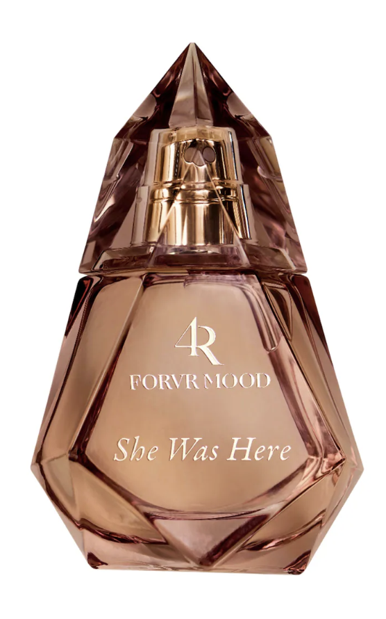 "FORVR Mood She Was Here Eau de Parfum in a geometric amber glass bottle, a warm gourmand fragrance with notes of roasted pistachio and vanilla milk designed to blend with natural skin chemistry."