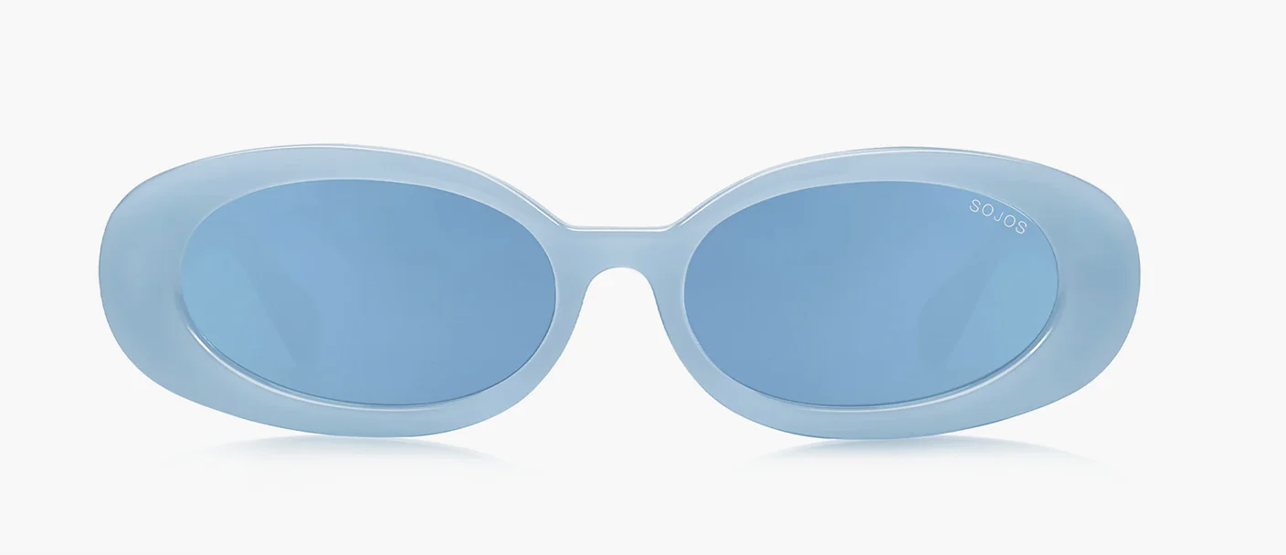 A pair of ocean-toned oval sunglasses with a thick translucent light blue frame and matching blue tinted lenses, shown against a transparent background.