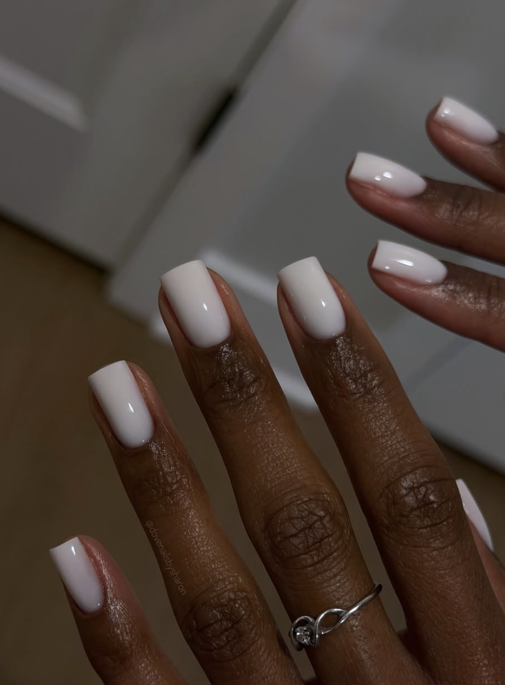 Short milky white winter nails with a soft translucent finish