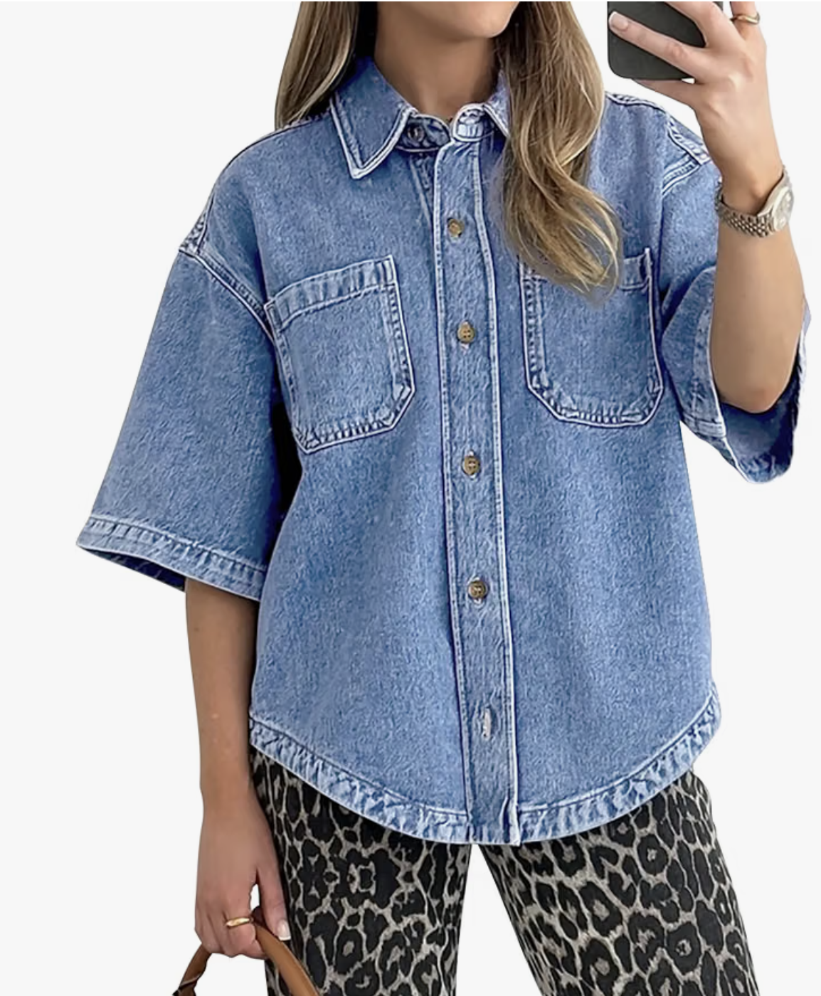Long sleeve denim shirt in a light wash, worn buttoned