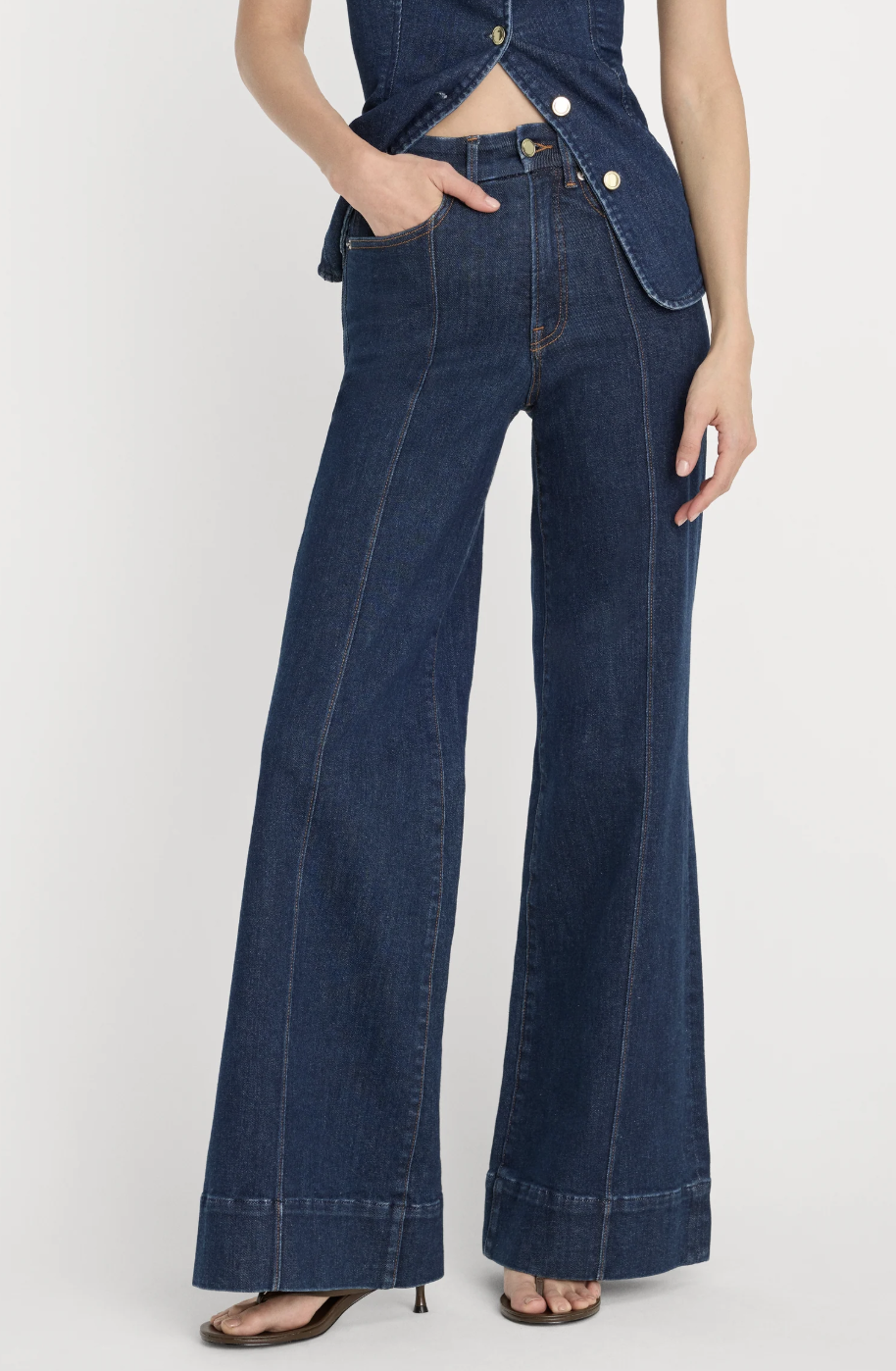 Dark wash wide-leg denim trouser jeans with wide hems.