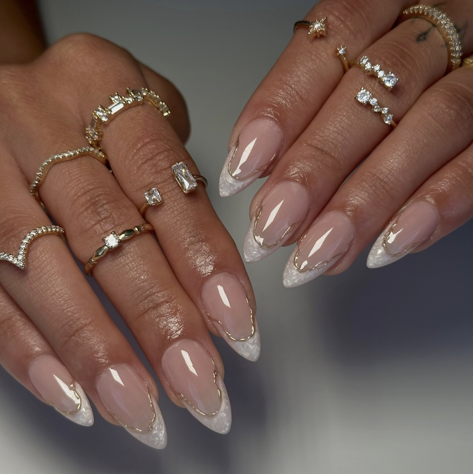 Sheer caramel manicure with one delicate gold-leaf accent