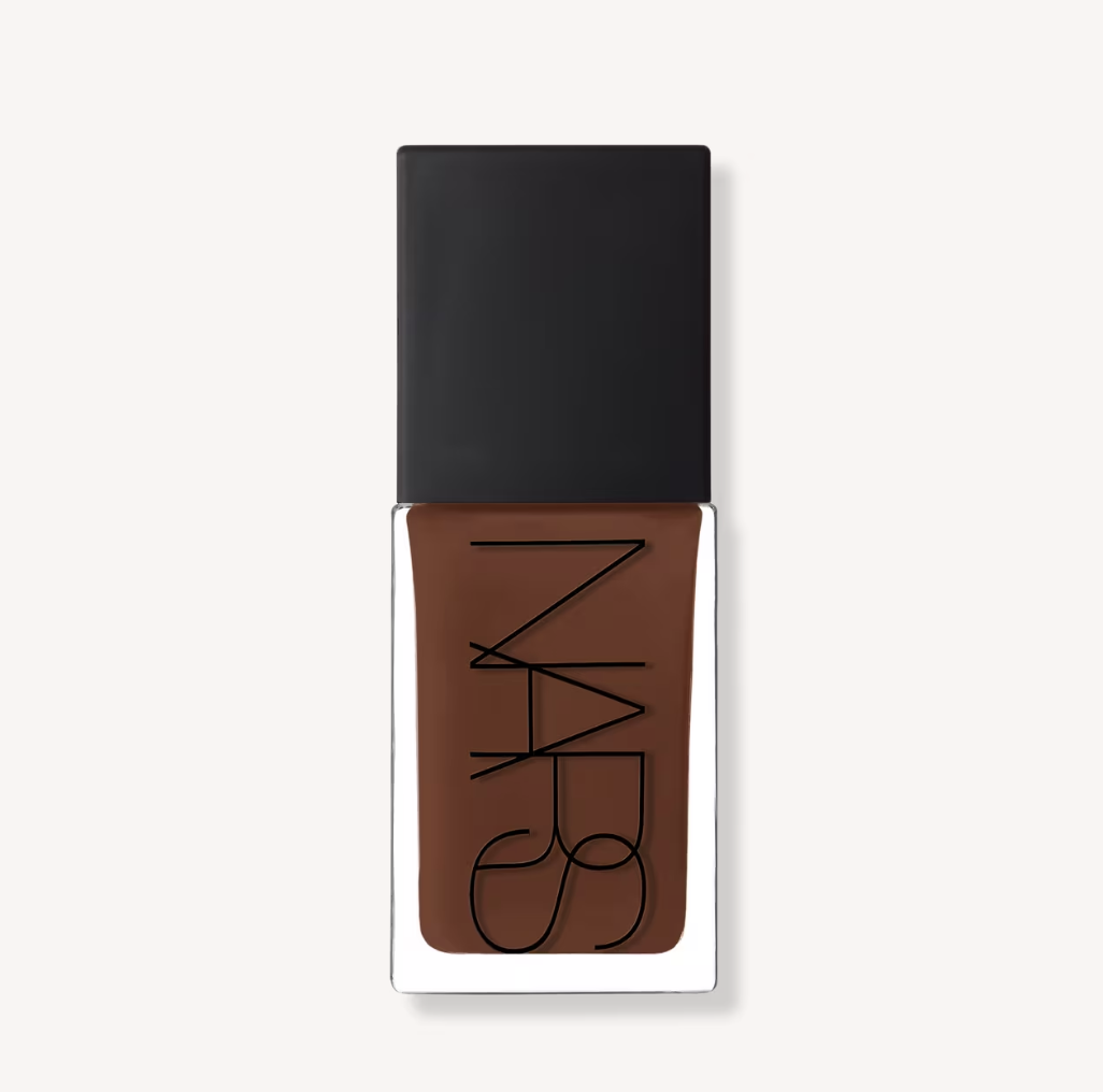 A bottle of NARS Light Reflecting Advanced Skincare Foundation filled with a deep liquid makeup formula against a clean white background.