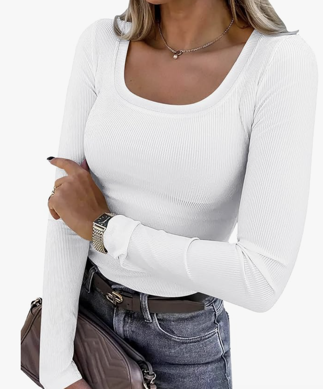 A pro stylist-recommended white ribbed long sleeve crewneck shirt tucked into jeans with a brown belt, perfect for a clean and simple base layer.
