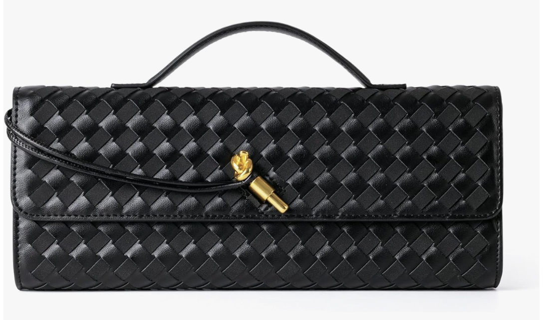 Close up of a black woven leather clutch bag with a gold knot clasp and a thin crossbody strap.