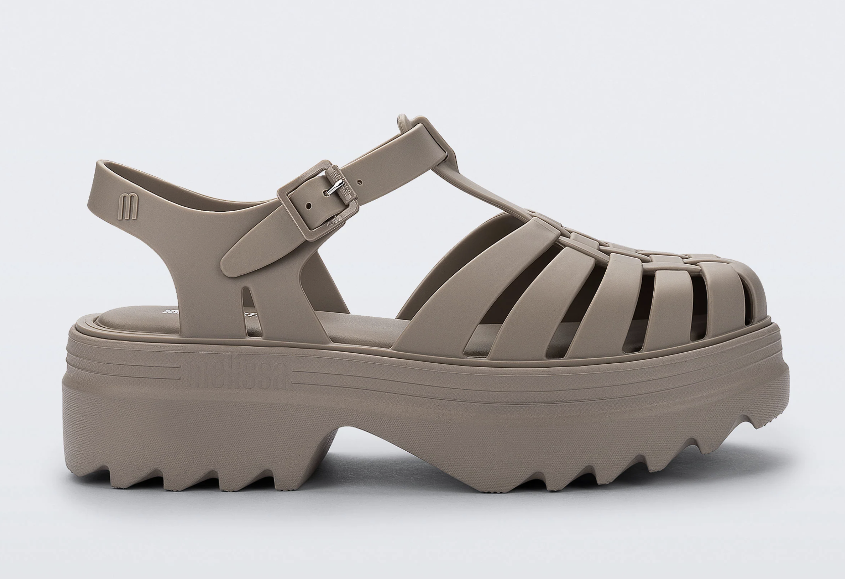Close-up of the Melissa Possession Platform II sandals in beige water-resistant material featuring a caged fisherman strap design, adjustable ankle strap with a buckle, and a chunky lugged platform sole.