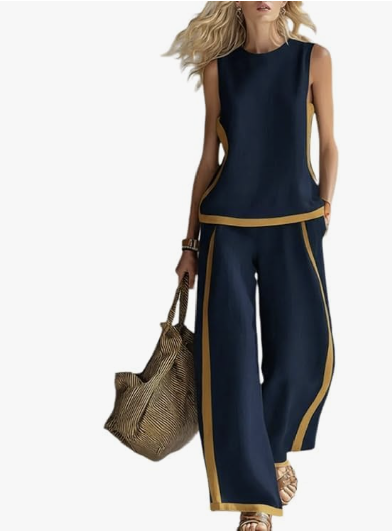 A matching navy blue and tan color-block two-piece women's lounge set featuring a sleeveless crewneck top and fluid wide-leg pants with contrasting border detail.