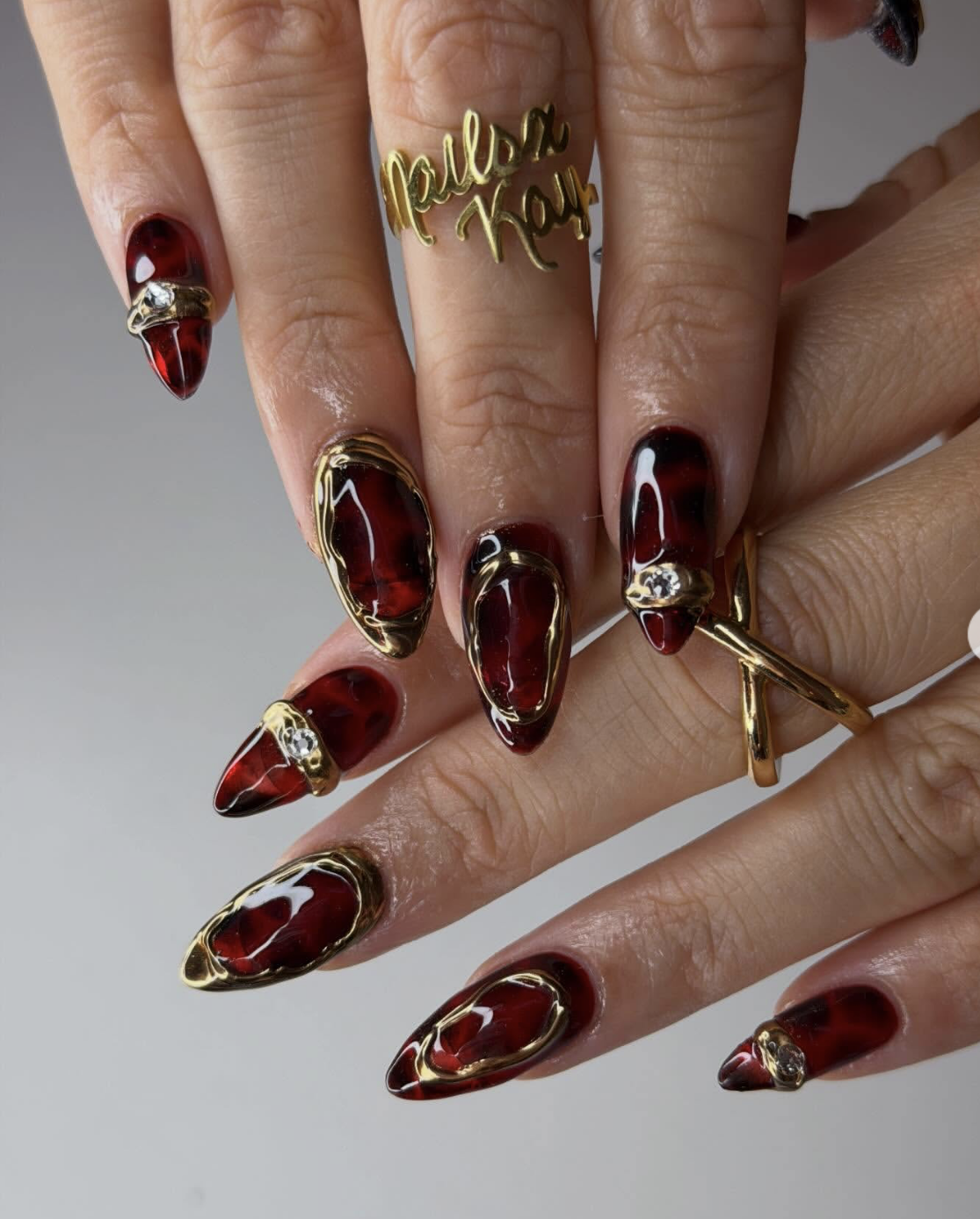 Red tortoiseshell nail art design