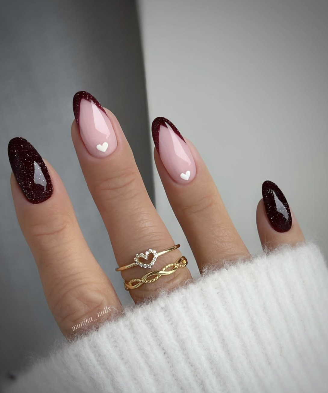 Close-up of black cherry french on neatly manicured hands