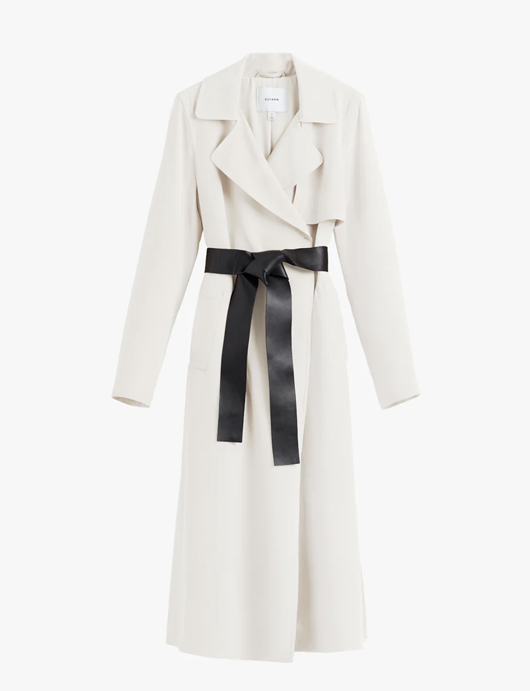 The Cuyana Silk Classic Trench in a crisp white color, featuring a relaxed fluid drape, black contrast belt, and storm flap, shown in a studio product shot.