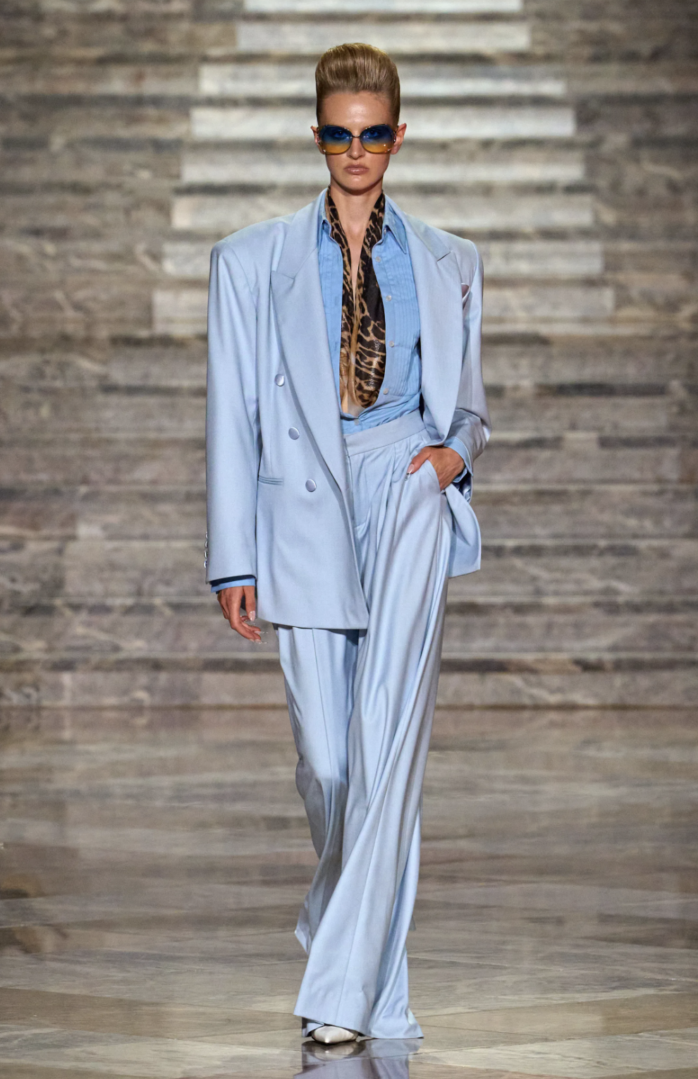 LaQuan Smith Spring 2027 powder-blue double-breasted suit with wide-leg trousers and a leopard-print scarf