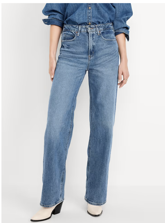 Woman wearing Old Navy extra high-waisted wide-leg jeans in a medium blue wash.