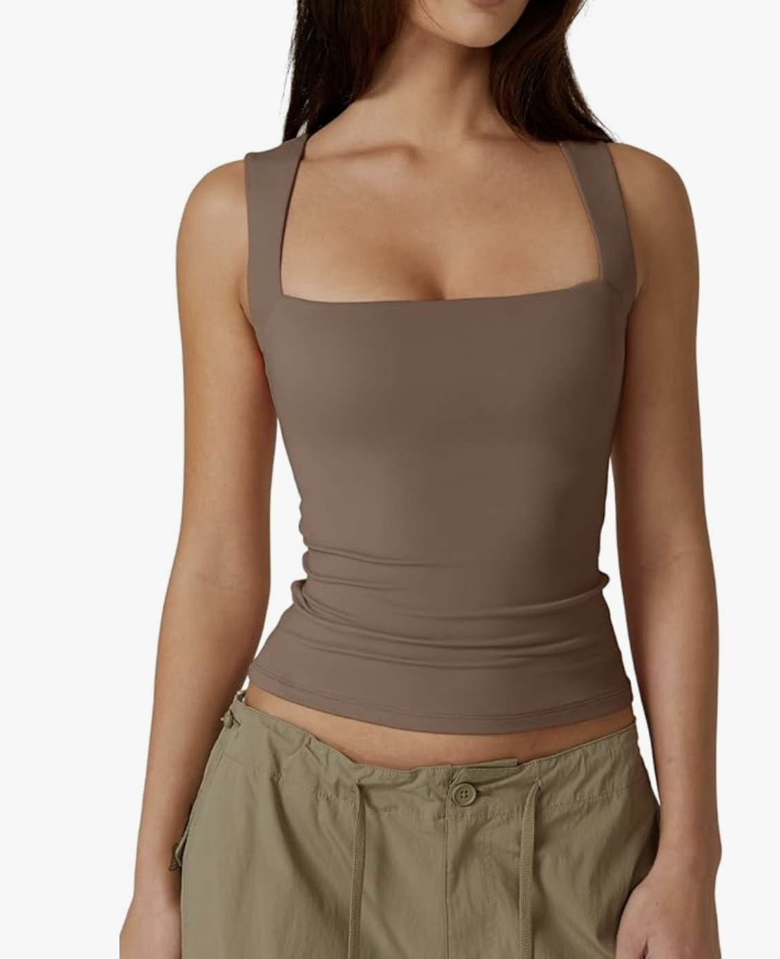 A close-up view of a person wearing a fitted, cropped square-neck tank top in olive brown styled with drawstring pants.
