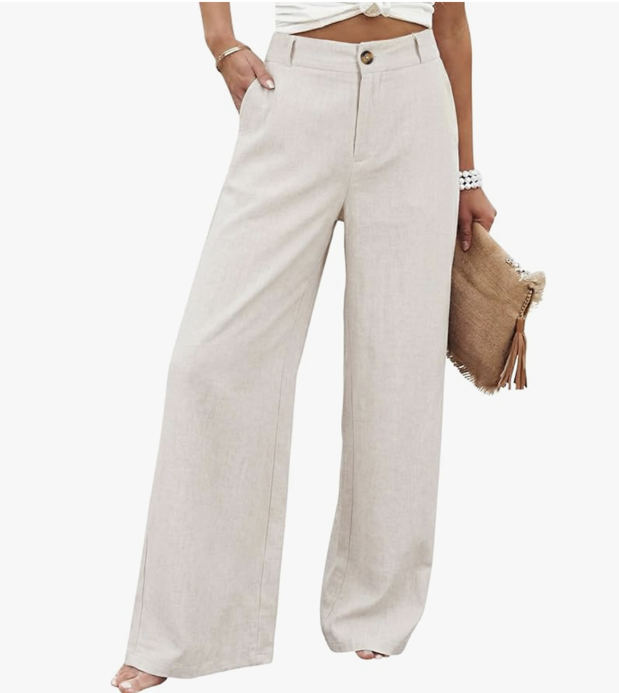 A pair of black TARSE linen palazzo pants with an elastic drawstring waistband and pleated wide-leg detail, styled with a small brown leather handbag.