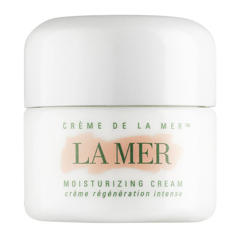 A white jar of Crème de la Mer moisturizing cream displayed on a clean surface.