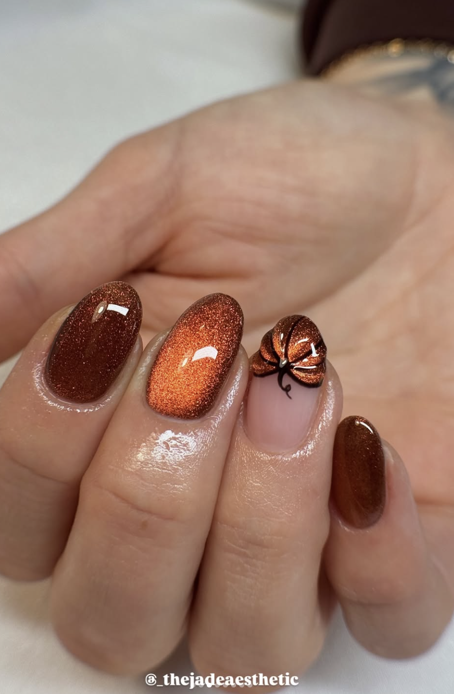 Caramel aura manicure with delicate pumpkin accent art