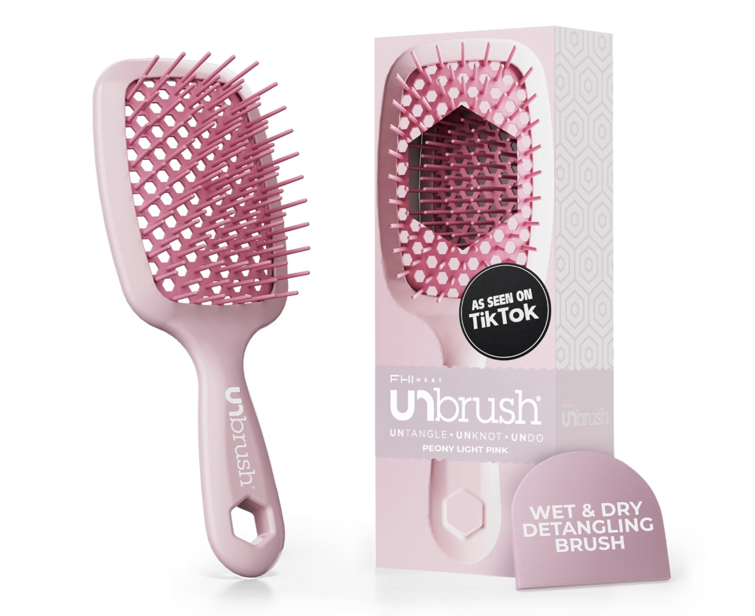 A matte pink FHI Heat Unbrush detangling hair brush next to its matching pink packaging box against a white background.