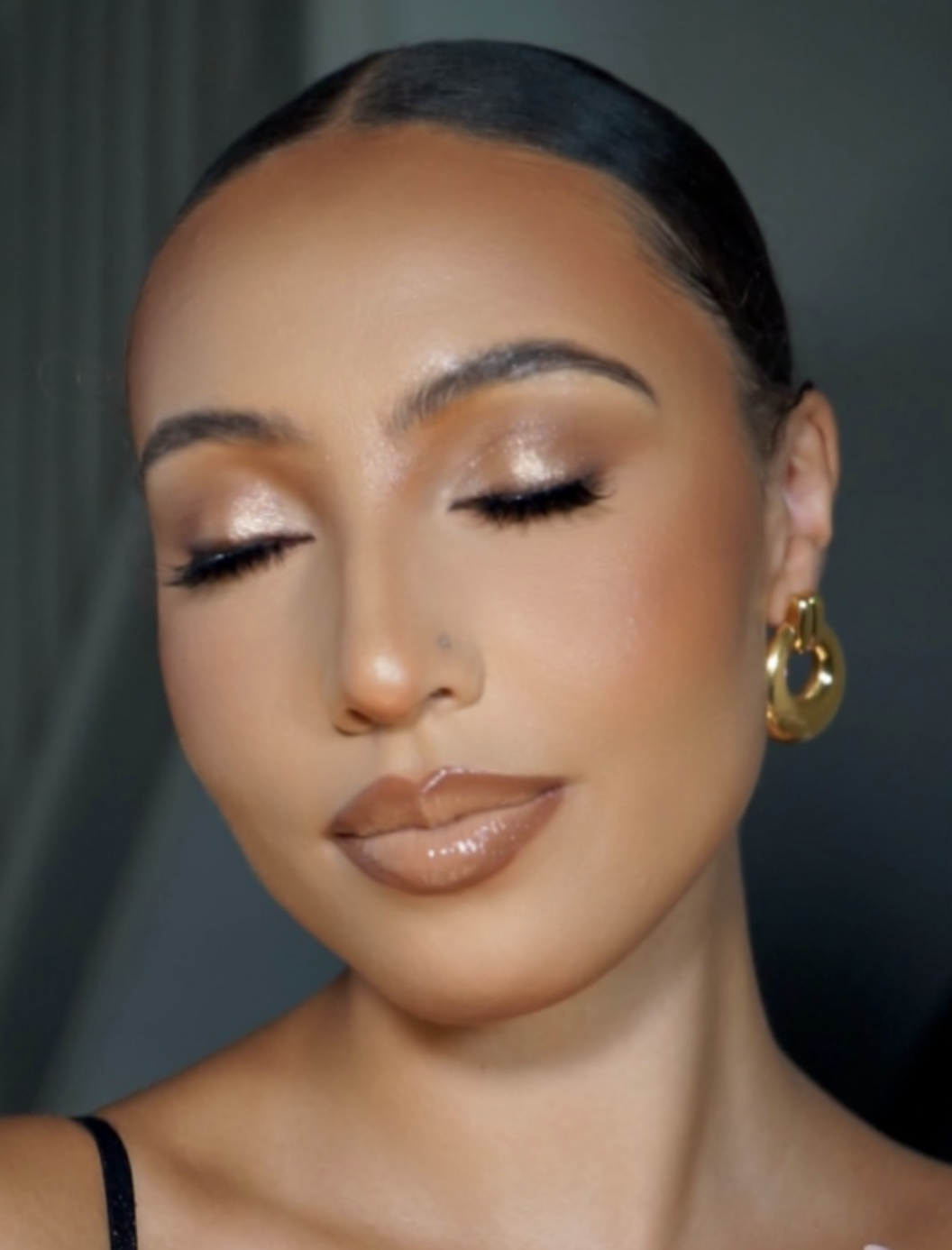 Rose-gold shimmer eyeshadow paired with softly glowing skin