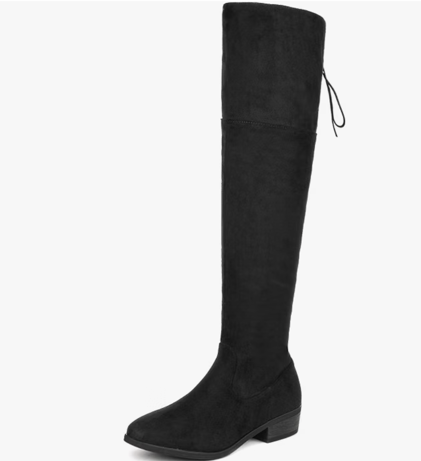 Over-the-knee boots worn with slim jeans tucked in