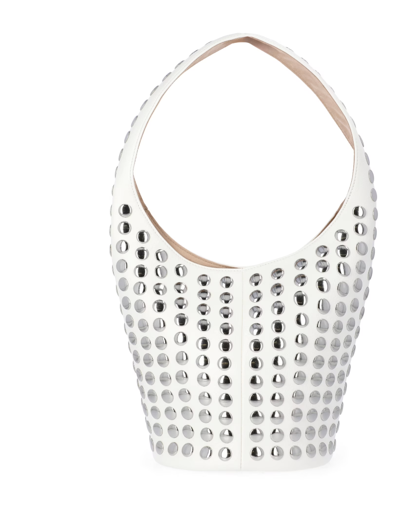 A white faux-leather bucket-style shoulder bag featuring all-over silver stud embellishments and a circular metal handle