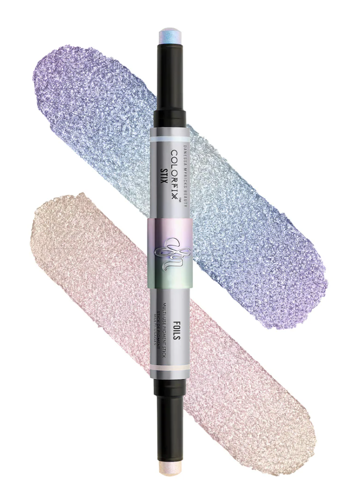 Danessa Myricks Beauty Colorfix Stix dual-ended eyeshadow stick featuring multi-use pearl shimmer pigments in cool blue-gray tones against a transparent grid background.
