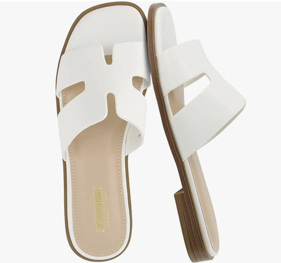 A pair of white cutout strap slide sandals from Amazon, perfect for a casual summer BBQ outfit.