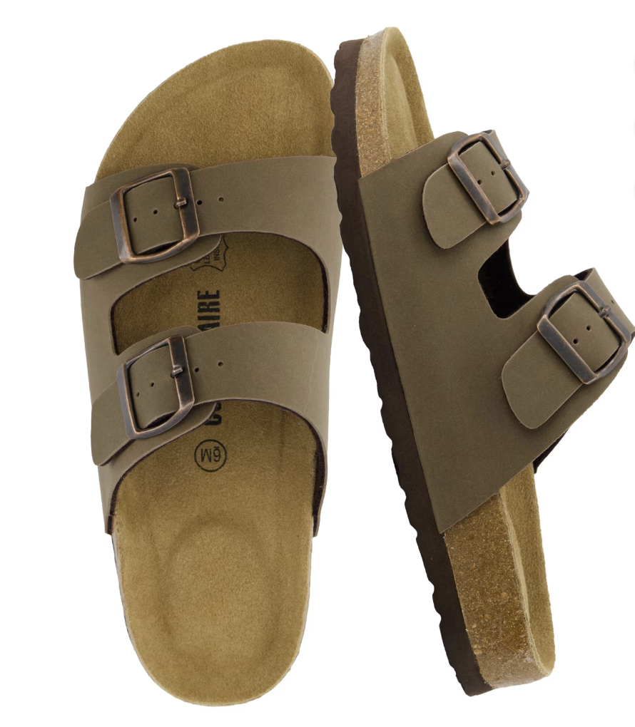 A pair of tan faux suede double-buckle slide sandals with a cork-style footbed, displayed as a comfortable and trendy summer footwear option.