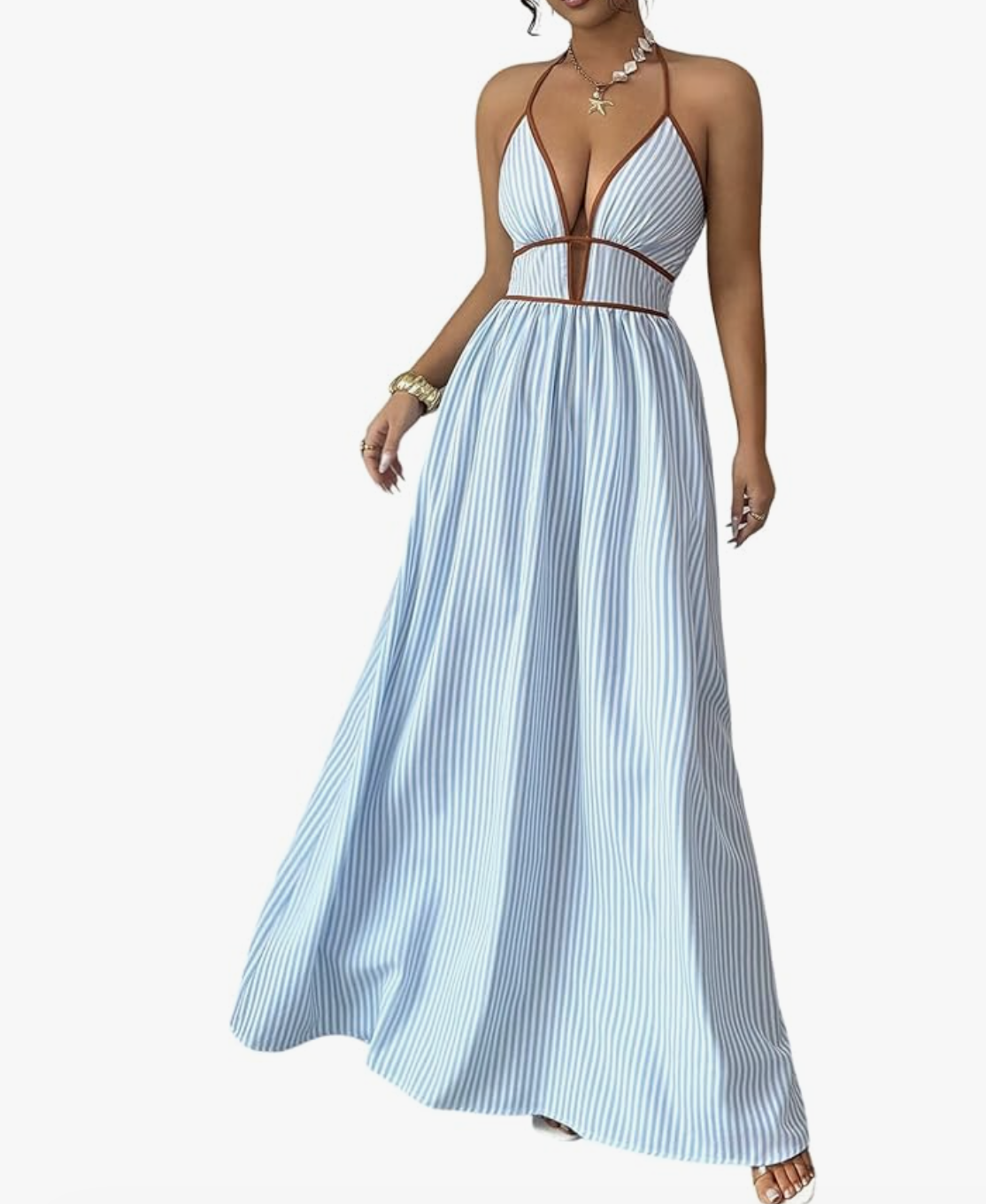 Editorial summer style featuring a blue and white vertical-striped halter maxi dress with a plunging neckline, perfect for elongating a petite frame.
