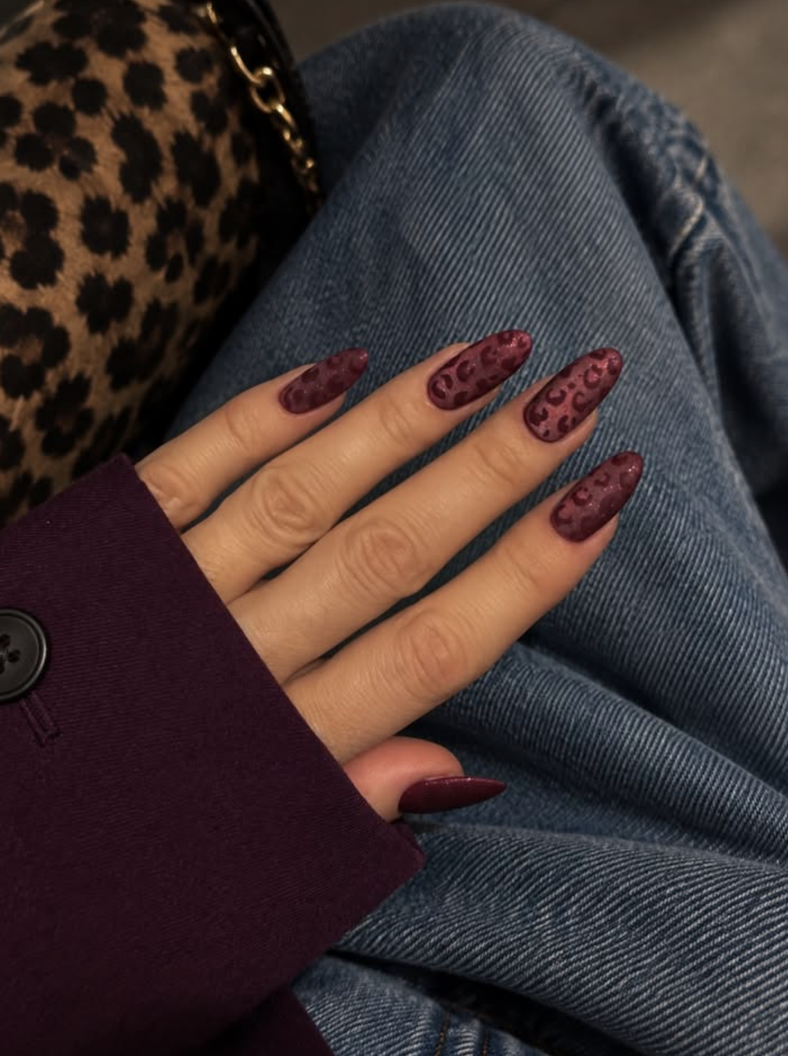 Burgundy magnetic cat-eye nails with a soft velvet shimmer