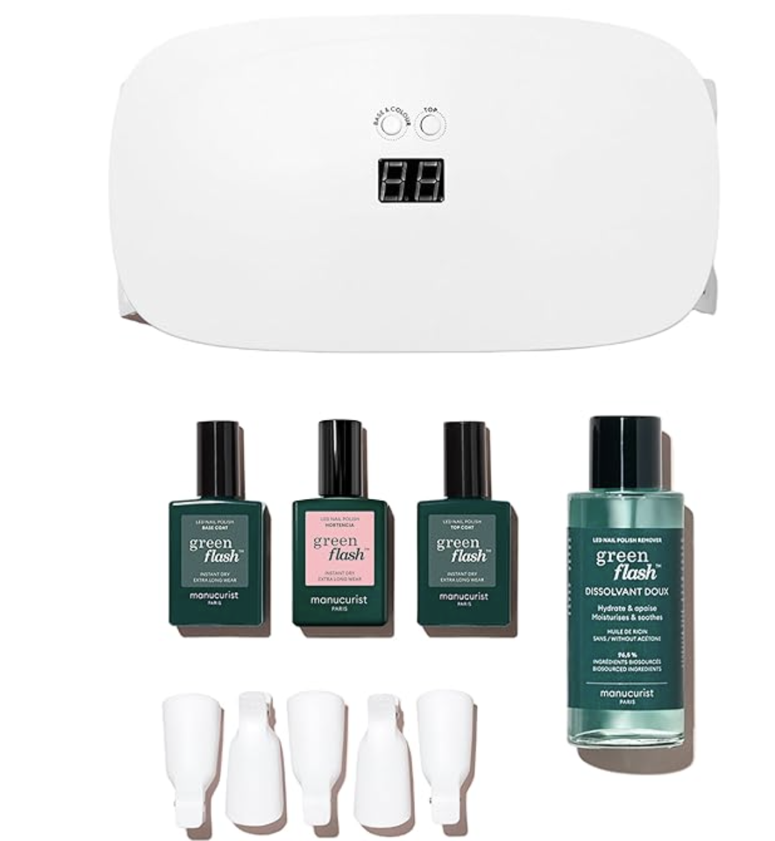 Manucurist Green Flash Slim LED Nail Gel Kit including a white LED lamp, base coat, top coat, and three green and pink gel polishes.