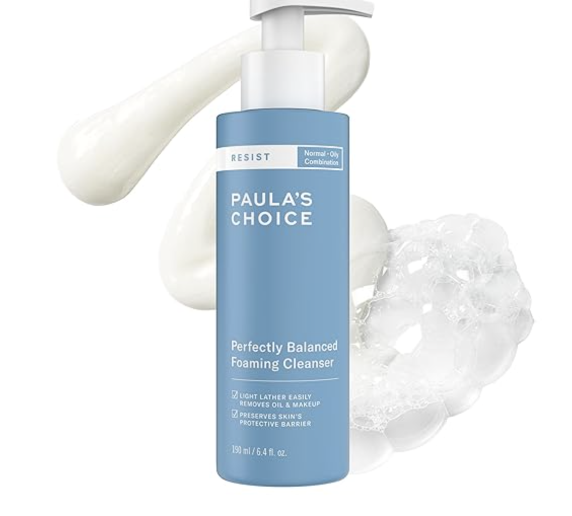 A bottle of Paula's Choice RESIST Perfectly Balanced Foaming Cleanser for normal, oily, or combination skin, shown with a smooth white cream and clear gel texture bubble background.