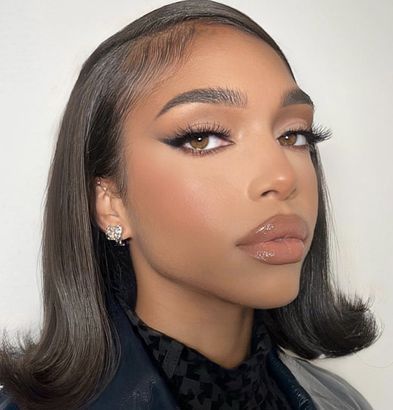 Close-up of a softly smudged brown smoky eye with neutral lips