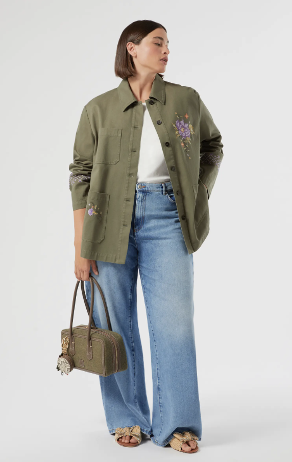 Woman wearing Marina Rinaldi Sriva wide leg jeans in a polished navy wash designed for curvy figures.