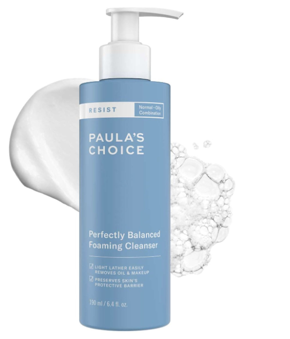 Blue pump bottle of Paula's Choice RESIST Perfectly Balanced Foaming Cleanser with a cream swatch and foam bubbles.